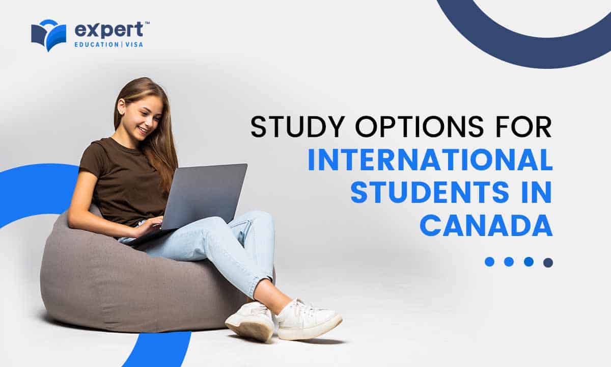 student sitting on a bean bag while working on a laptop